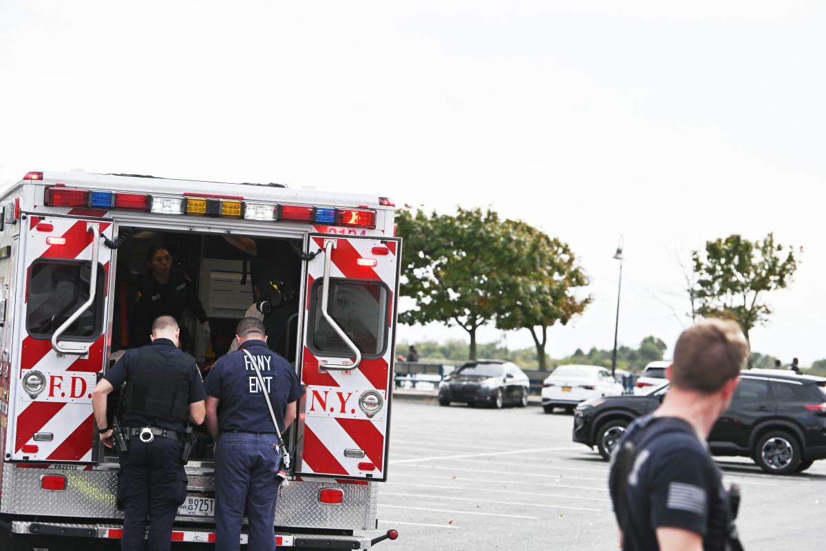 Paramedics tend to a a man rescued from the Canarsie Pier.