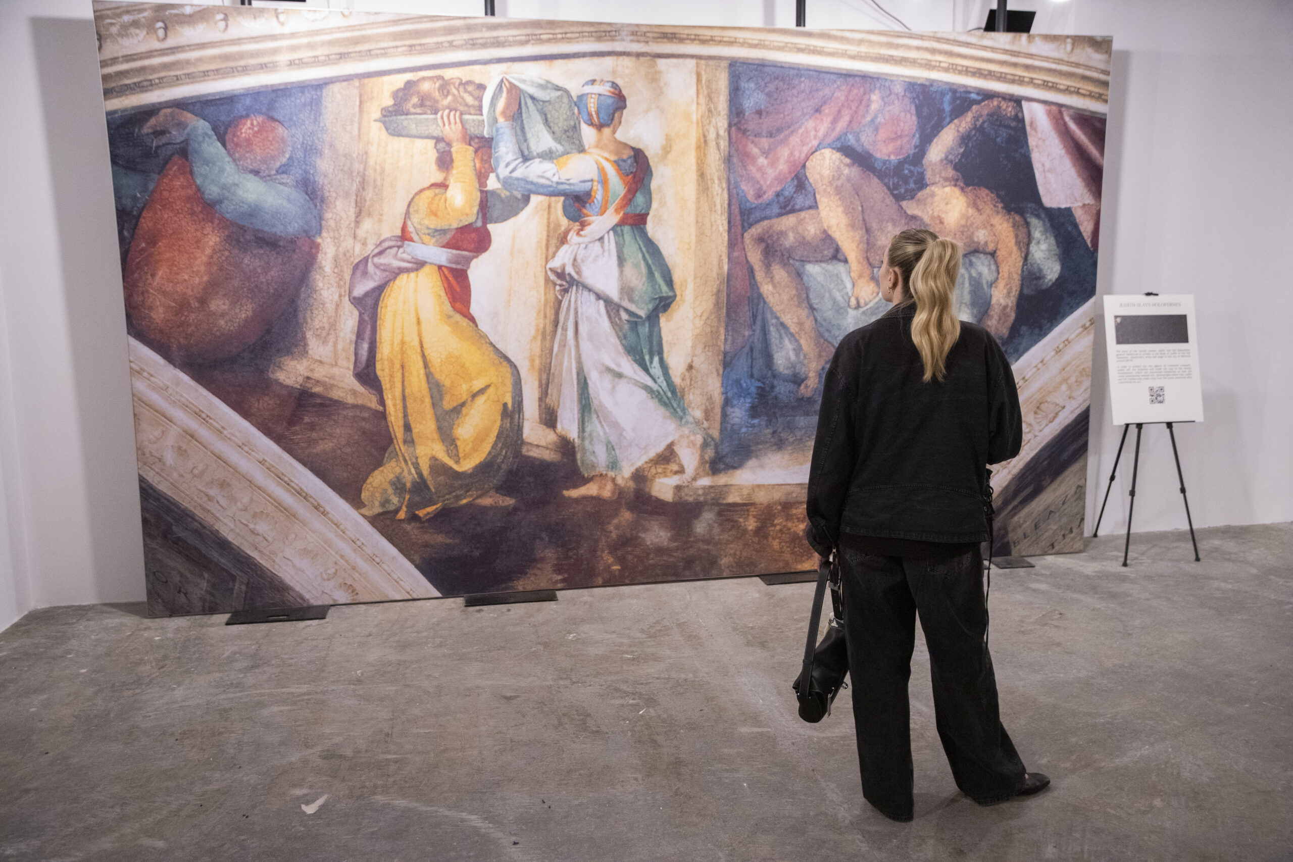 A guest admires Michelangelo's work. Photo by John McCarten