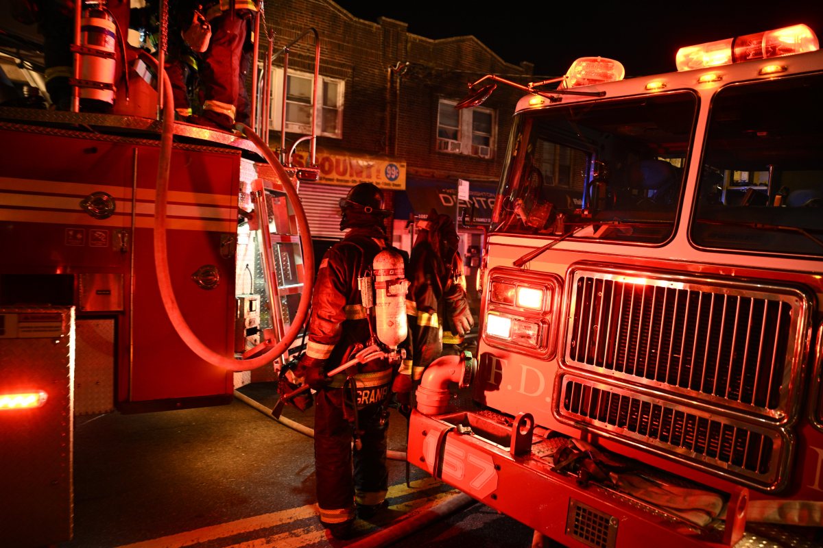 A firefighter battles heavy smoke and fire while battling a three alarm fire at 1074 Castleton Avenue.