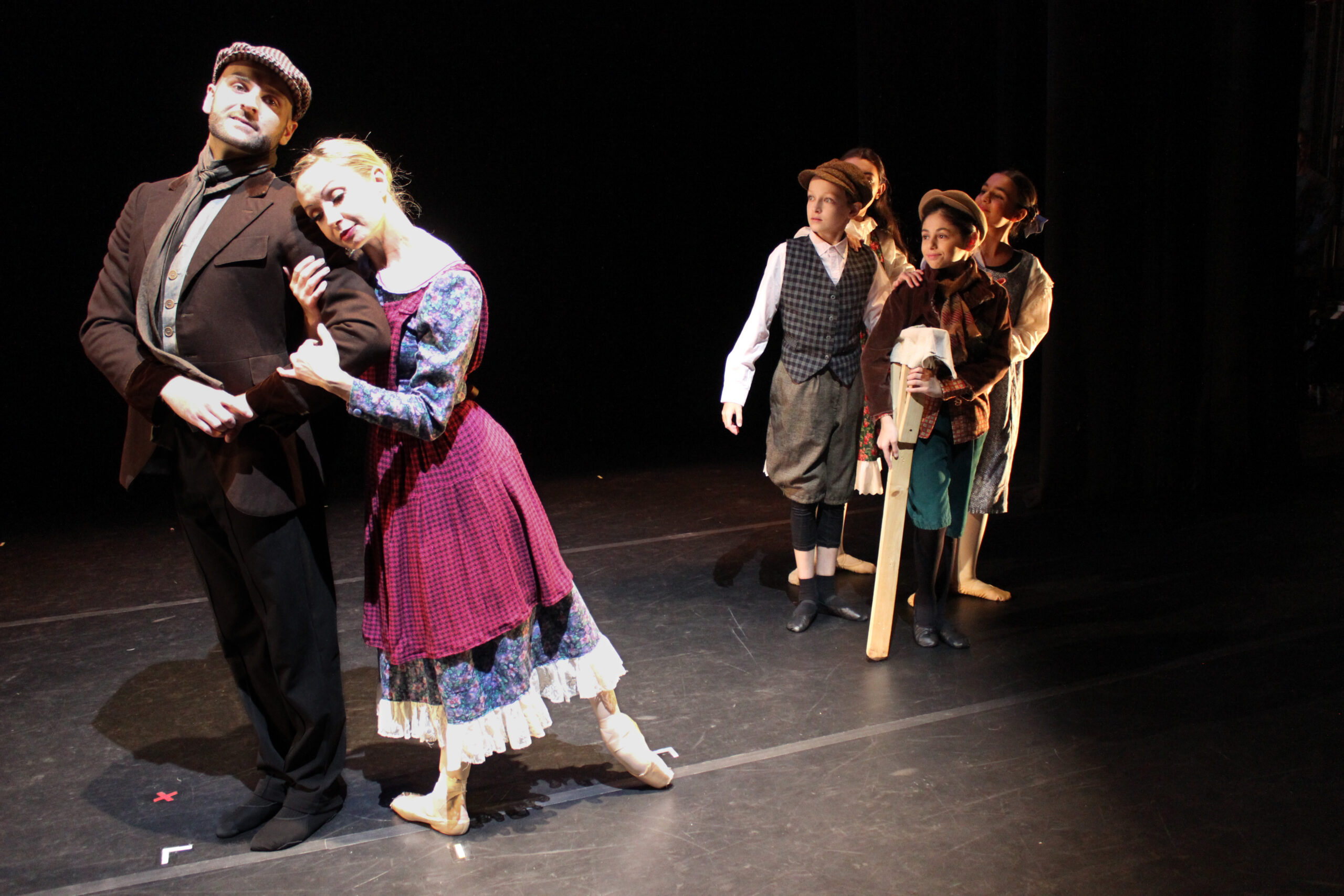 The Cratchit family: Bob Cratchit (James Felton II), Mrs. Cratchit (Tanya Trombly), Oleg Kolbas (Peter Cratchit), Alessandra Gamez (Martha Cratchit, hidden), Miriami Vibliani (Tiny Tim) and Nino Tsertsadze (Belinda Cratchit). Photo courtesy of Jaime Gamez Photography 