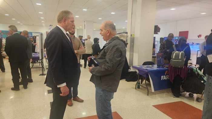 MTA CEO Janno Lieber (left) speaks to a member of the public at Wednesday's Open House for the 2025-29 Capital Plan. Photo: Shane O'Brien