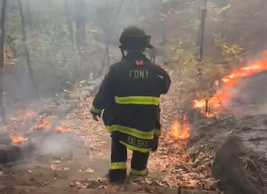 Firefighter at Inwood Hill Park battles wildfire