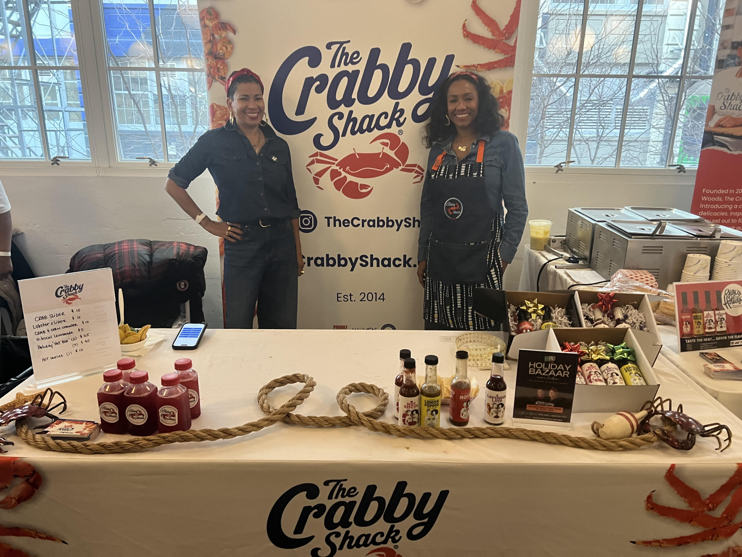 Gwen Woods (left) and Fifi Bell-Clanton, co-owners of the Crabby Shack. Photo by Wayne Daren Schneiderman 