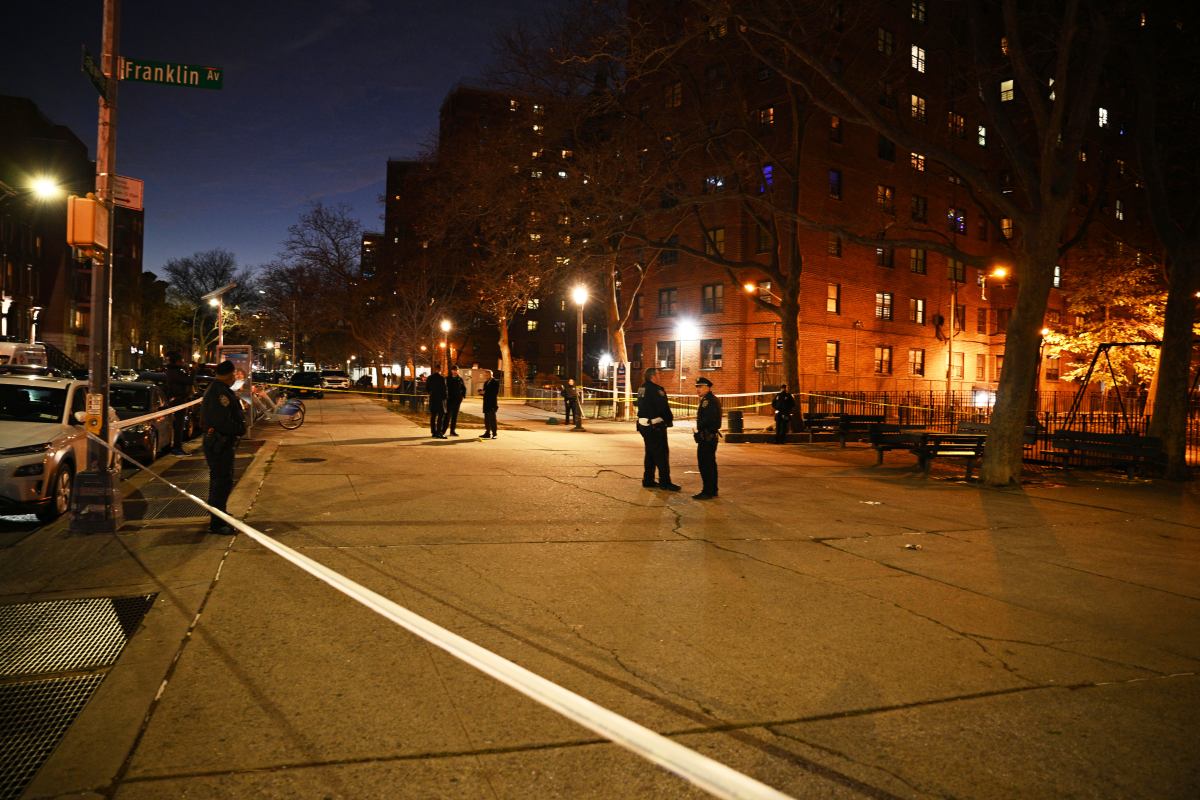 Police at the scene of a shooting at a NYCHA complex in Brooklyn.